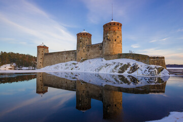 At the old fortress of Olavinlinna (Olafsborg) in the March evening. Savonlinna, Finland