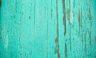 Fototapeta na wymiar Grunge background. Peeling paint on an old wooden floor. Vintage wood background. Old Wood texture