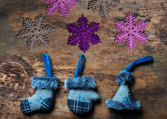 mittens gloves, winter boots - Christmas toys. merry christmas and happy new year background greeting card