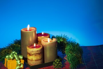 Close up view of Christmas burning candles and decoration objects. Postcard. Christmas and New Year holidays concept background.