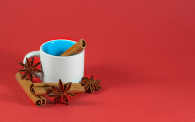 image of empty coffee and tea cup, cinnamon and anise close-up
