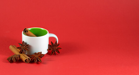 image of empty coffee and tea cup, cinnamon and anise close-up
