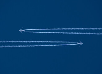 Airplane in the sky with a trace of steam contrail.Airliner.