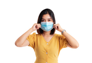 Young Asian woman wearing protection mask isolated on white background.