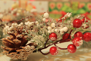 Christmas background made of christmas tree branch, cones and berries