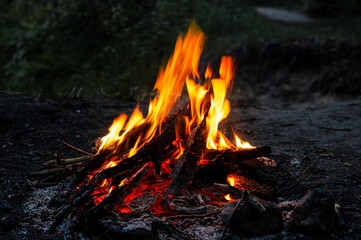 Bright hot campfire on a dark night