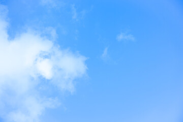 Obraz premium White clouds with blue sky Background On a bright day with copy space for text or banner for website