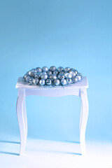 Small table with advent wreath with shiny christmas balls