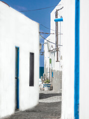 narrow alleys with typical white houses near the ocean in El Cotillo.Fuerteventura, Canary Islands, Spain.