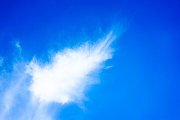Fototapeta na wymiar White clouds on blue sky with copy space for banner or wallpaper background. freedom concept