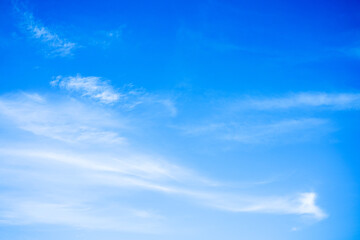 Naklejka na ściany i meble Beautiful White clouds on blue sky with copy space for banner or wallpaper background. freedom concept