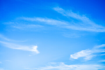 Naklejka na ściany i meble Beautiful White clouds on blue sky with copy space for banner or wallpaper background. freedom concept