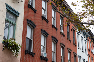 Fototapeta na wymiar Row of Colorful Old Brick Residential Buildings in Hoboken New Jersey
