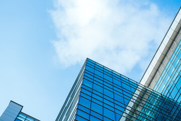 underside panoramic and perspective view to steel blue glass high rise building skyscrapers, business concept of successful industrial architecture