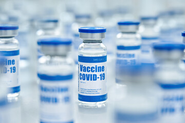 Covid 19 coronavirus vaccine vial bottle for intramuscular injections on medical pharmaceutical industry background. Corona virus cure manufacture, flu treatment drug pharmacy production concept.