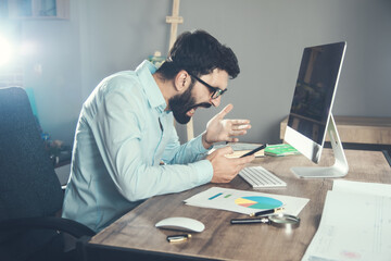 Angry businessman working in the office