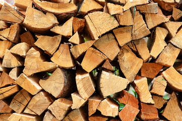 Stacking fire wood. Firewood texture. Fire wood background. Woodpile fire wood. Storage of fire wood. Heat generation.