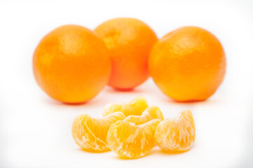 Naklejka na ściany i meble Fresh ripe orange fruits and orange slice isolated on the white background