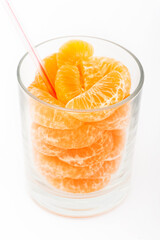 real natural orange juice with sliced in a glass. White background isolated.