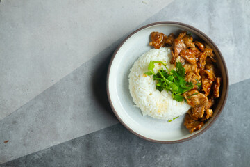 Fried pork with garlic and pepper on rice