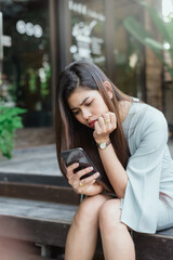 Women using smartphones with anxious face