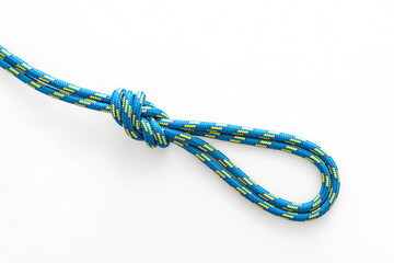 Figure 8 double loop knot pulled tight on a white background