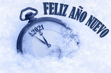 2021 greeting card, Happy New Year 2021, in Spanish language, Feliz ano nuevo text, countdown to midnight