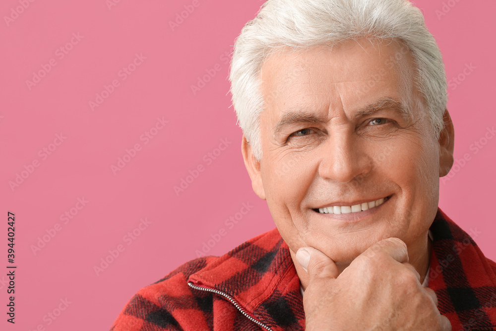 Poster Stylish senior man on color background