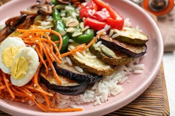 Plate of delicious rice salad with vegetables, closeup
