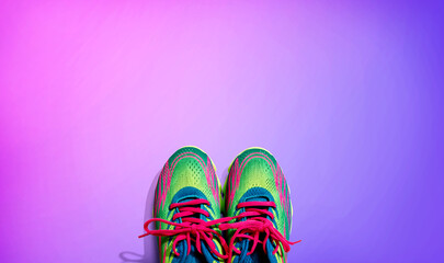 Pair of sport shoes with pink laces - flat lay
