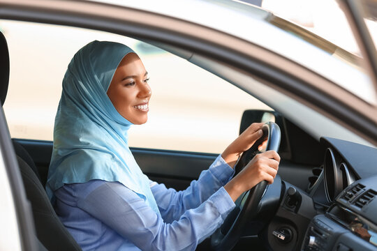 Young Muslim Woman Driving Car