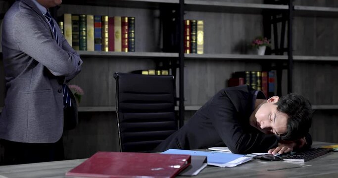 The boss catches that the lazy employee is secretly sleeping at work.