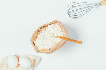 Flat lay composition with paper bag of organic flour