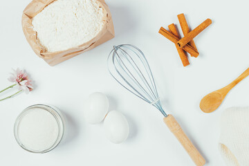 Bakery ingredients, flour, eggs, sugar and cinnamon