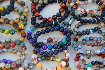lots of colorful beads and bracelets