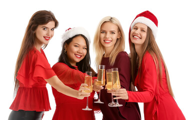 Young women with glasses of champagne on white background. Happy Near Year and Merry Christmas celebration