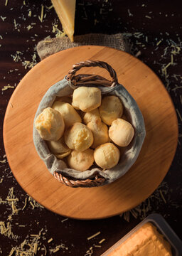 Homemade cheese buns, rustic style, vintage wooden background, top view. typical food from minas gerais Brazil.