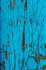 Wooden surface painted with blue paint, abstract background of a bench, fence or door