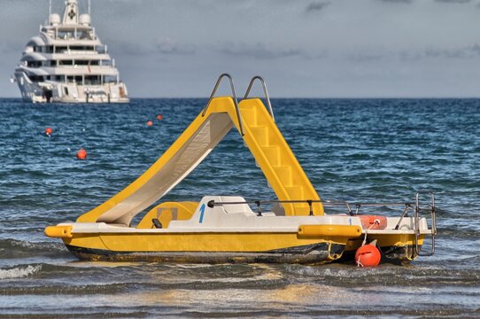 Yellow pedal boat in the sea