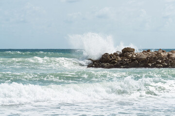 Wave crashing on the rocky reef
