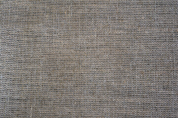 close-up texture of braided gray rough cotton natural fabric
