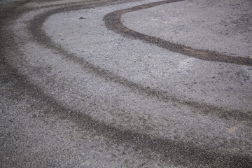 Wet wheel marks on the asphalt