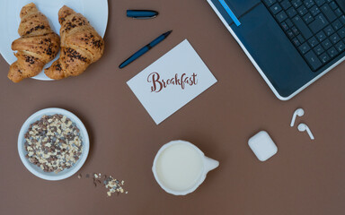 Business breakfast in office with coffee and croissant on white table background top view mock-up