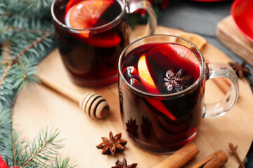Glass cup of tasty mulled wine on table