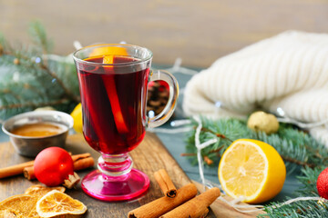 Glass cup of tasty mulled wine on table