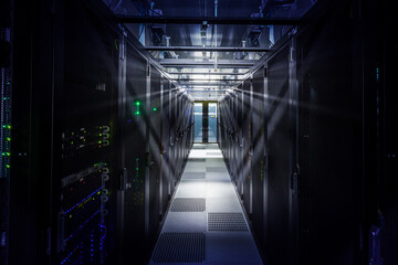 Network servers in a data center. Tier III carrier neutral data center. Server rooms.