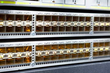 Network servers in a data center. Tier III carrier neutral data center. Server rooms.