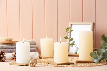 Beautiful aroma candles on table in bathroom