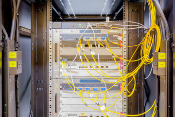Network servers in a data center. Tier III carrier neutral data center. Server rooms.