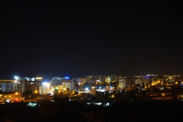 Fototapeta na wymiar city glows with bright colored lights
